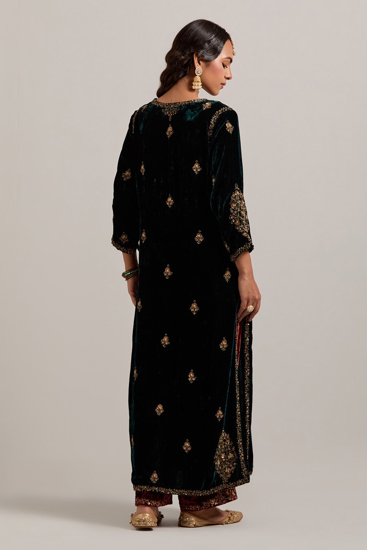 Dark green straight Silk Velvet kurta set with all-over hand-embroidered small floral booti with sequins, zardozi, bead and zari work.