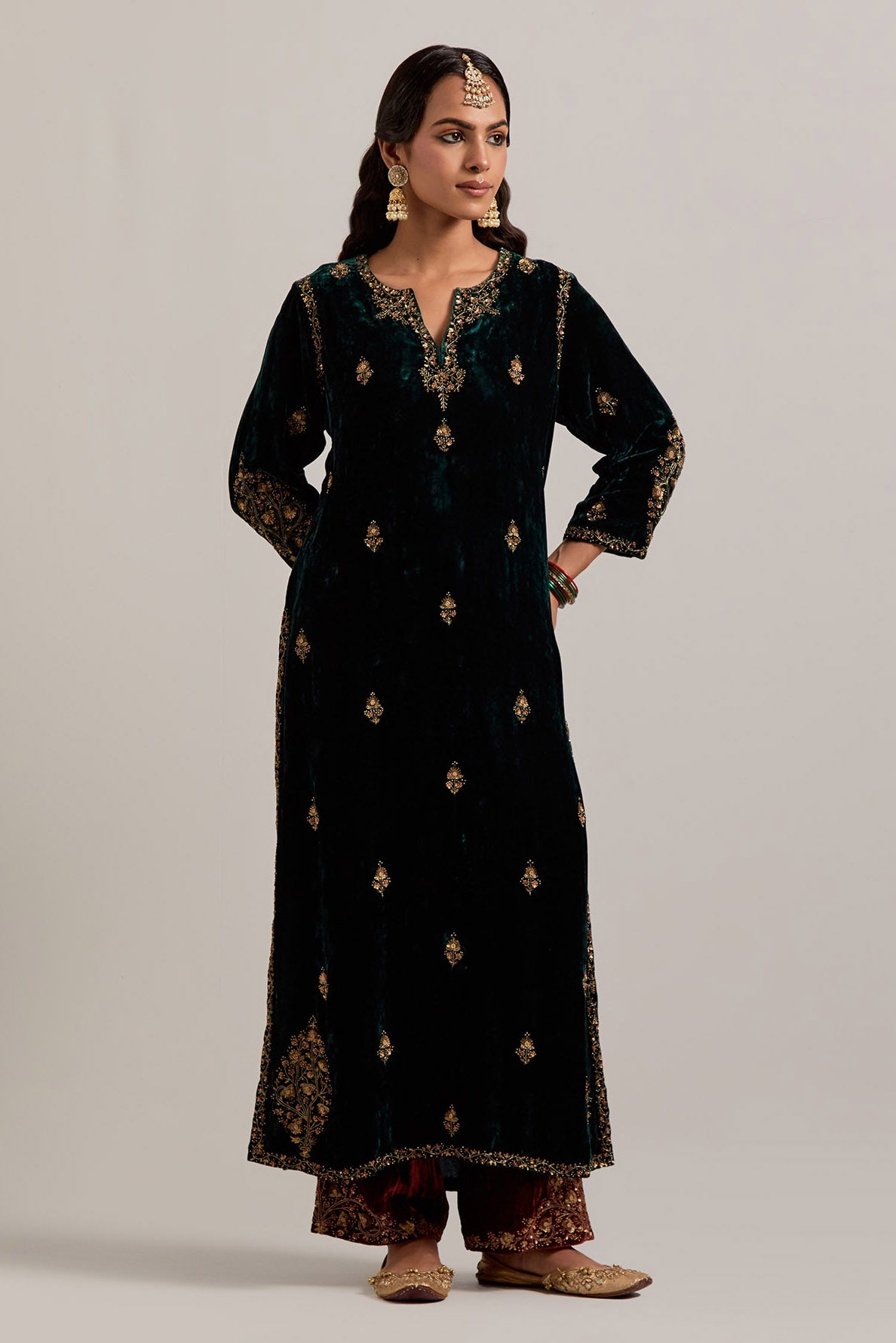Dark green straight Silk Velvet kurta set with all-over hand-embroidered small floral booti with sequins, zardozi, bead and zari work.