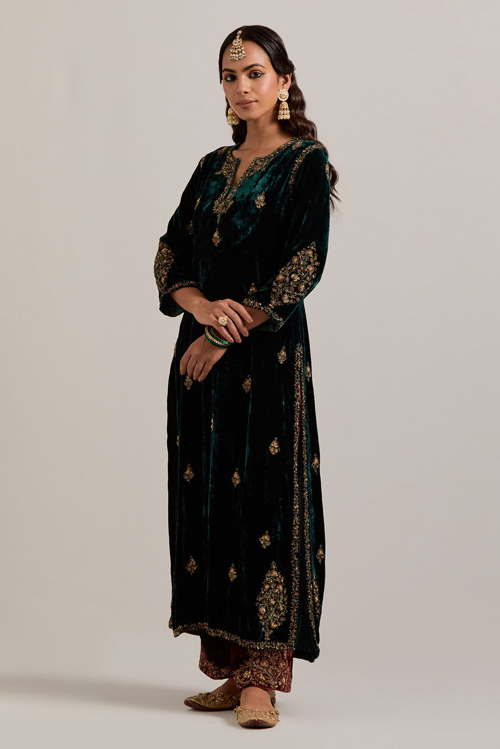 Dark green straight Silk Velvet kurta set with all-over hand-embroidered small floral booti with sequins, zardozi, bead and zari work.
