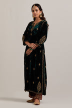 Dark green straight Silk Velvet kurta set with all-over hand-embroidered small floral booti with sequins, zardozi, bead and zari work.