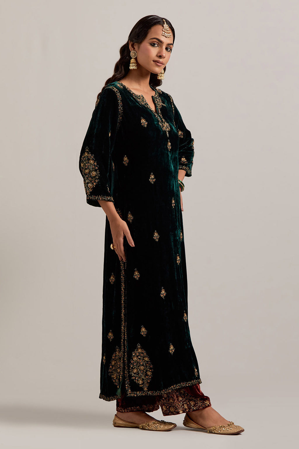 Dark green straight Silk Velvet kurta set with all-over hand-embroidered small floral booti with sequins, zardozi, bead and zari work.