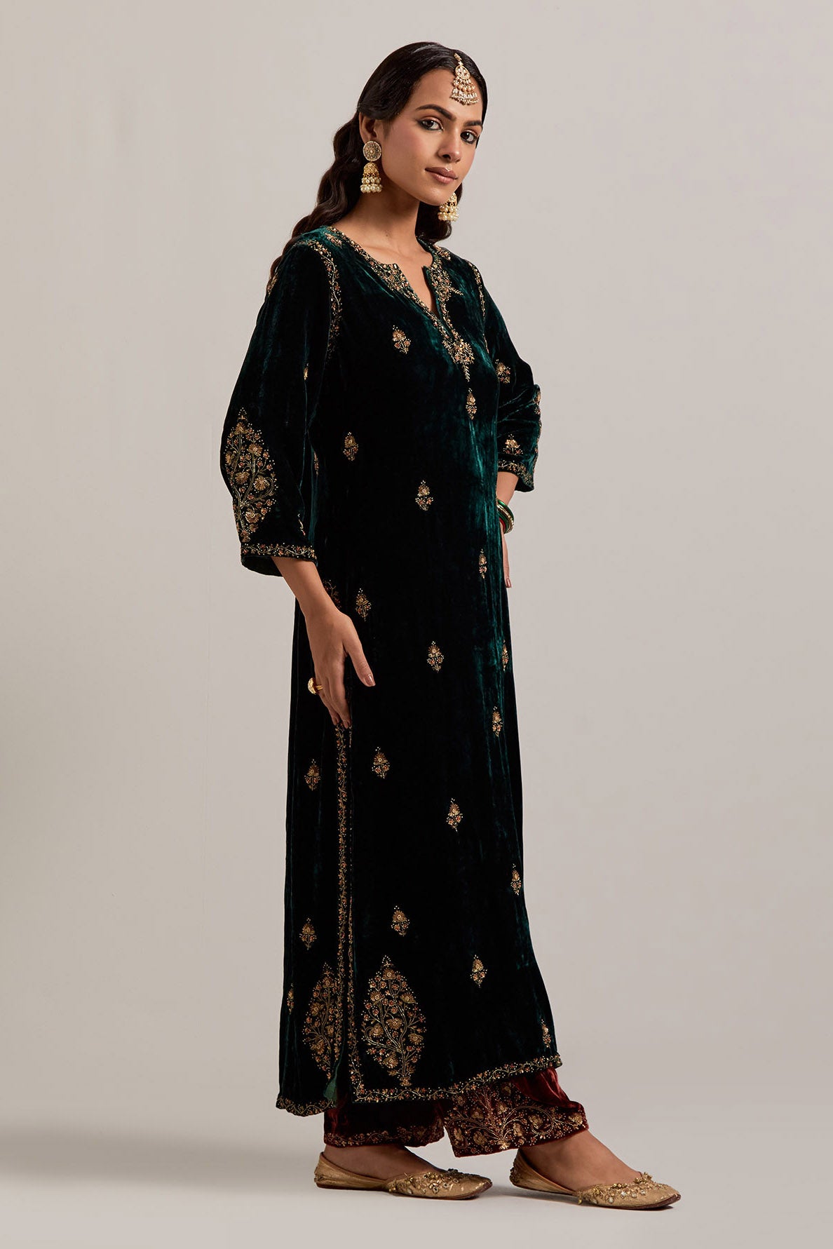 Dark green straight Silk Velvet kurta set with all-over hand-embroidered small floral booti with sequins, zardozi, bead and zari work.