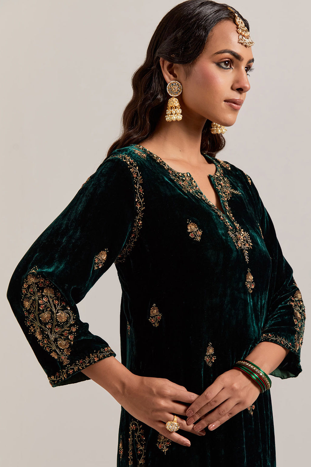 Dark green straight Silk Velvet kurta set with all-over hand-embroidered small floral booti with sequins, zardozi, bead and zari work.