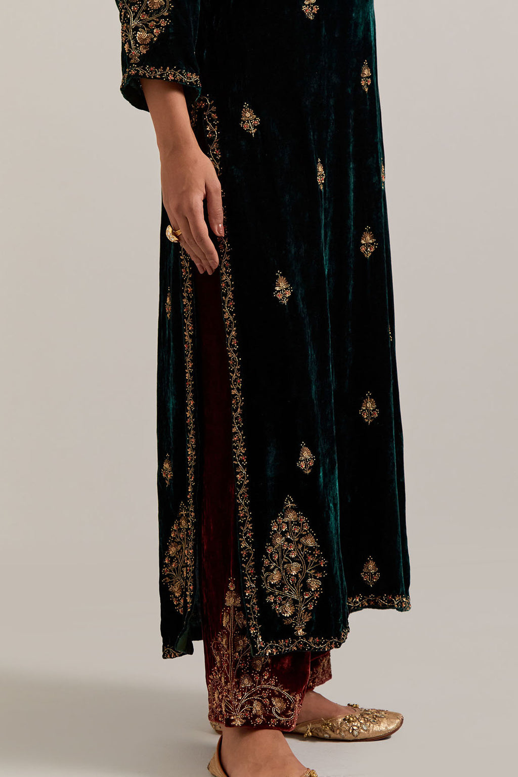 Dark green straight Silk Velvet kurta set with all-over hand-embroidered small floral booti with sequins, zardozi, bead and zari work.