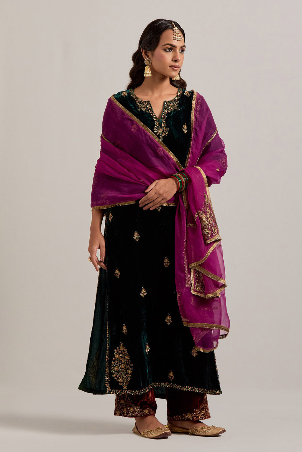 Dark green straight Silk Velvet kurta set with all-over hand-embroidered small floral booti with sequins, zardozi, bead and zari work.
