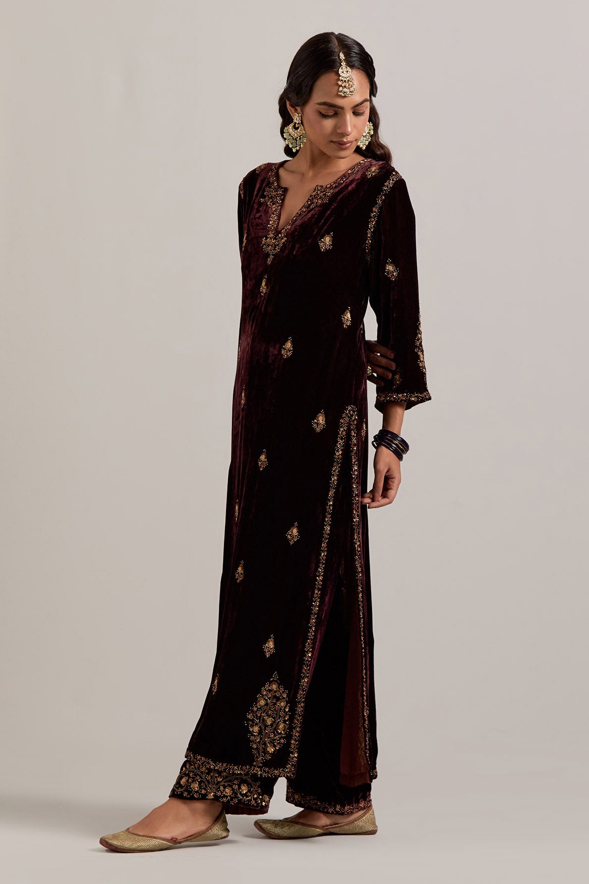 Rich brown straight Silk Velvet kurta set with all-over hand-embroidered small floral booti with sequins, zardozi, bead and zari work.