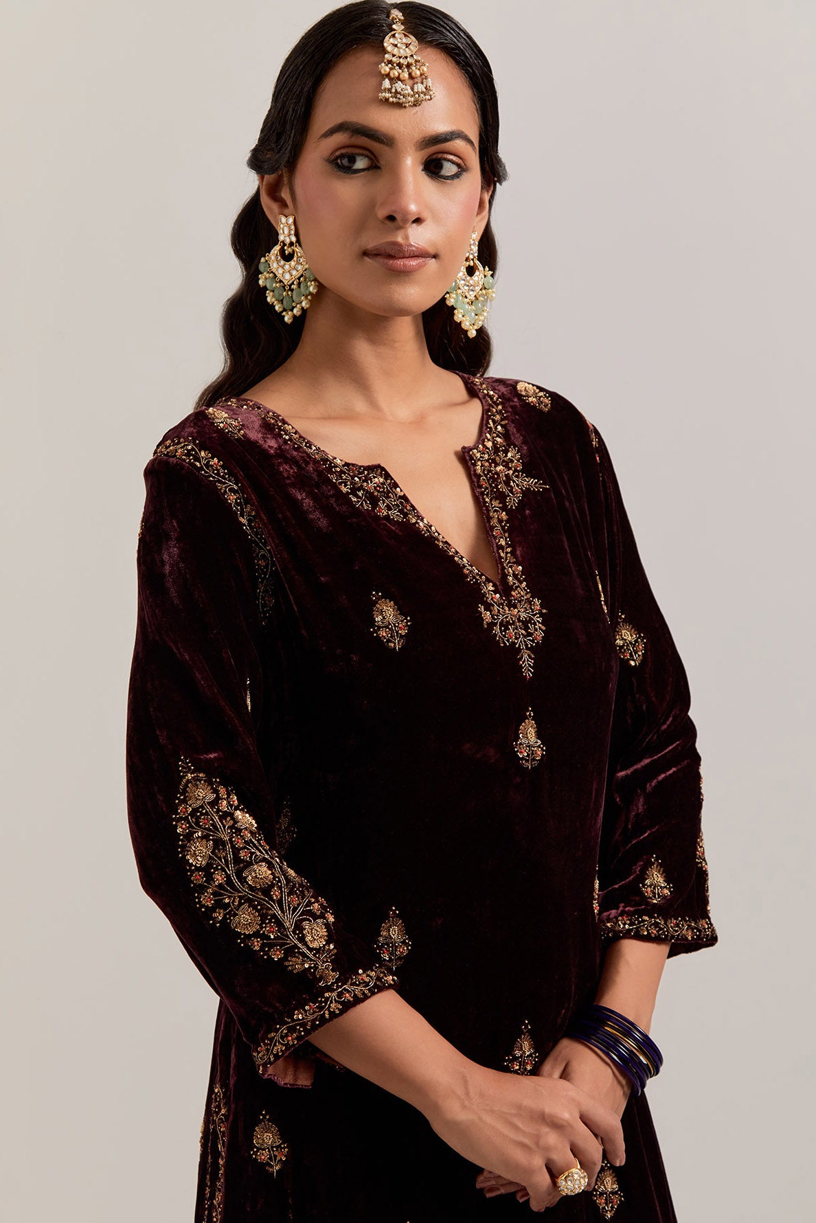 Rich brown straight Silk Velvet kurta set with all-over hand-embroidered small floral booti with sequins, zardozi, bead and zari work.