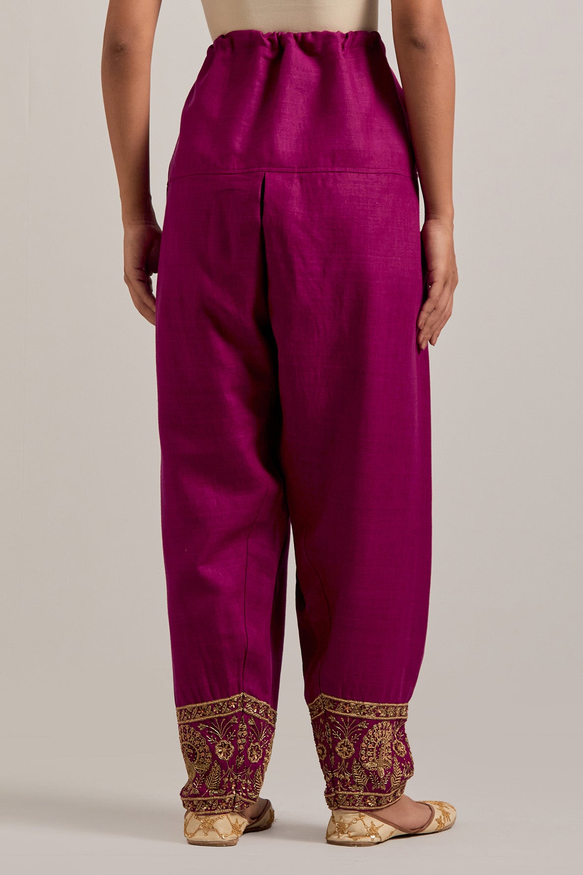 Fuchsia Matka silk salwar, highlighted with hand embroidered bead, sequins, zardozi and zari border at bottom hem.