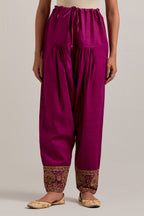 Fuchsia Matka silk salwar, highlighted with hand embroidered bead, sequins, zardozi and zari border at bottom hem.