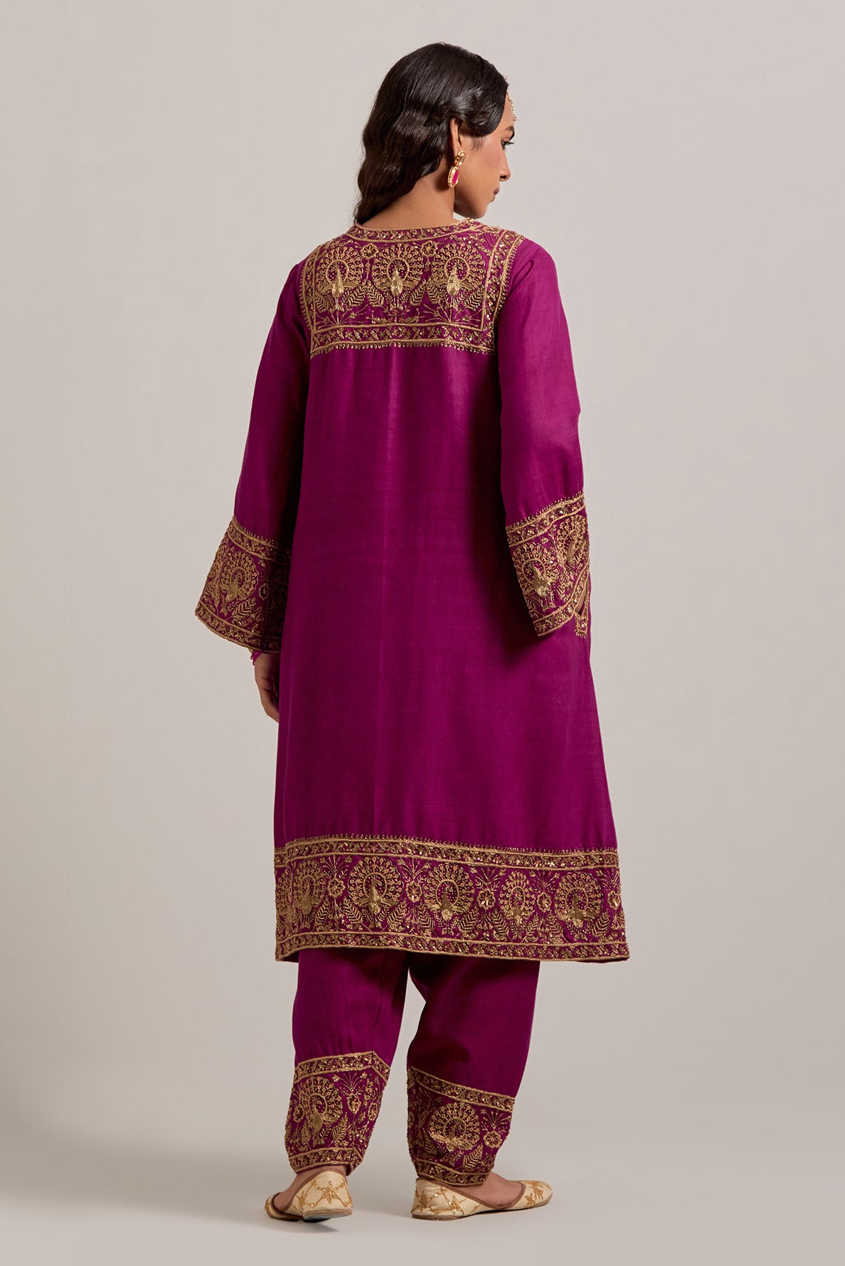 Fuchsia Matka silk short easy fit A-line kurta set with sequins, zardozi, bead and zari embroidered big border at hem, detailed with contrast colored bead.