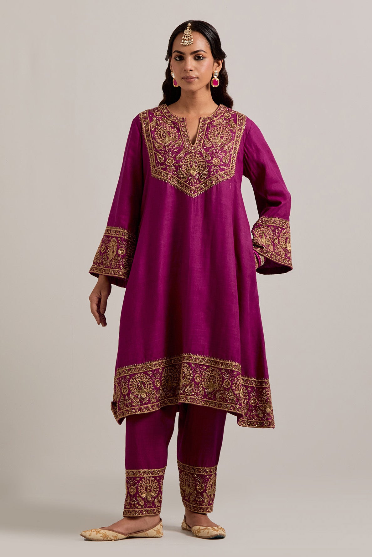 Fuchsia Matka silk short easy fit A-line kurta set with sequins, zardozi, bead and zari embroidered big border at hem, detailed with contrast colored bead.