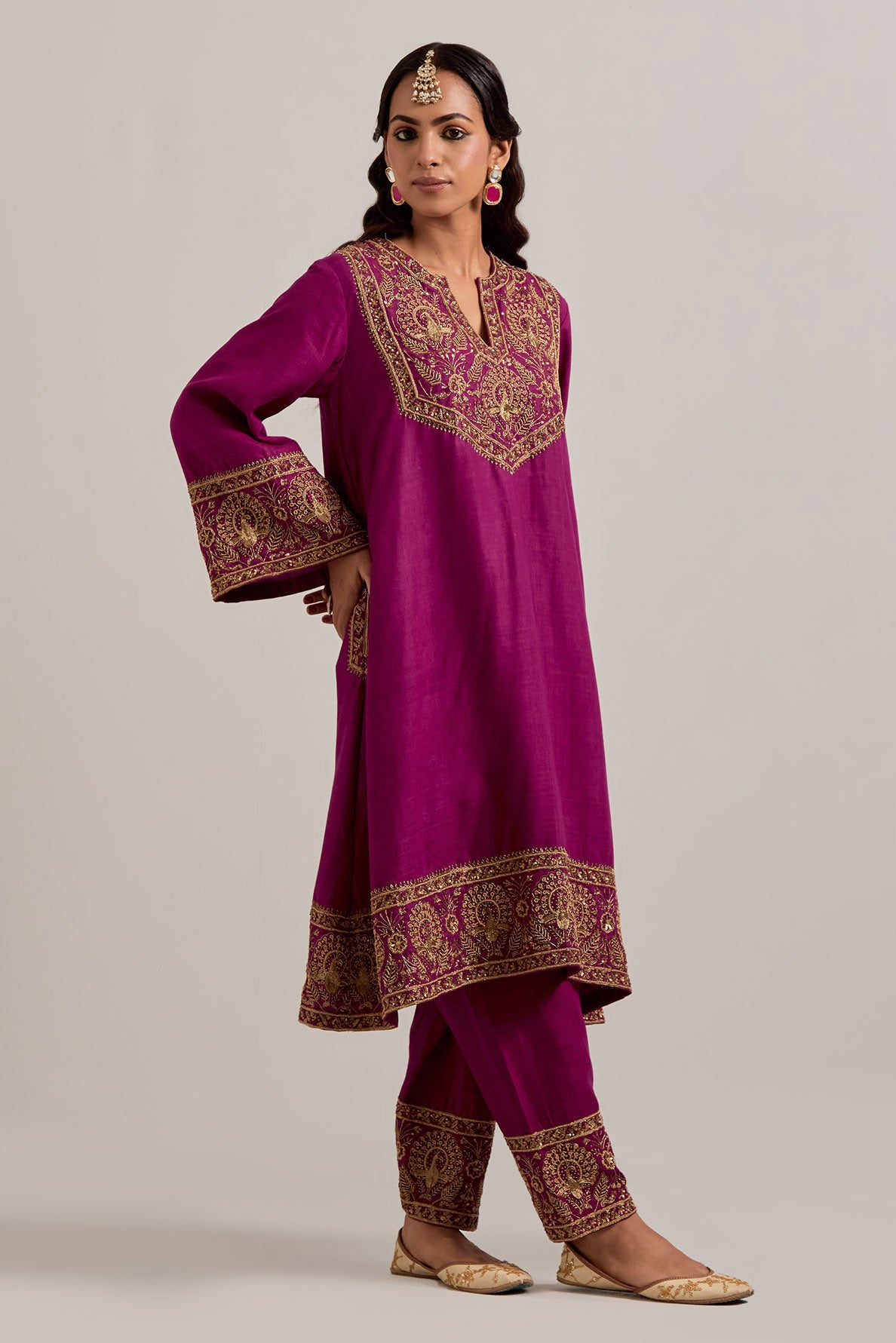 Fuchsia Matka silk short easy fit A-line kurta set with sequins, zardozi, bead and zari embroidered big border at hem, detailed with contrast colored bead.