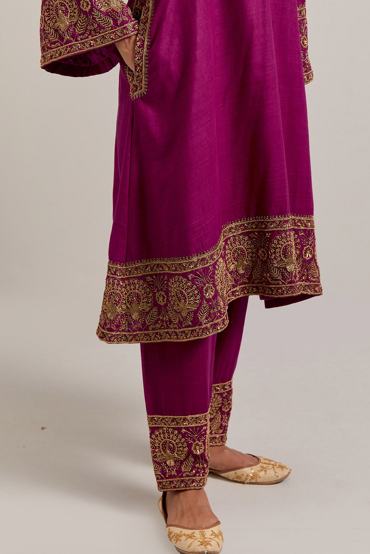 Fuchsia Matka silk short easy fit A-line kurta set with sequins, zardozi, bead and zari embroidered big border at hem, detailed with contrast colored bead.