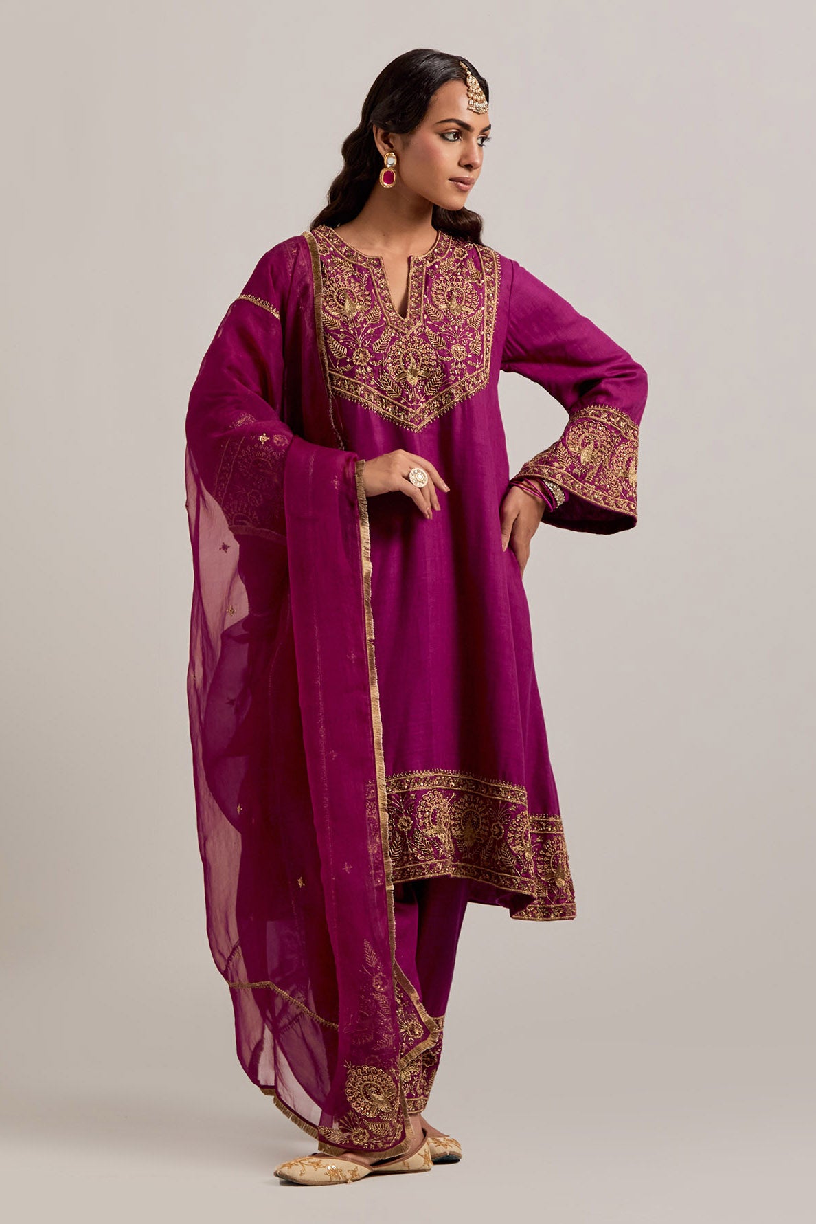Fuchsia Matka silk short easy fit A-line kurta set with sequins, zardozi, bead and zari embroidered big border at hem, detailed with contrast colored bead.