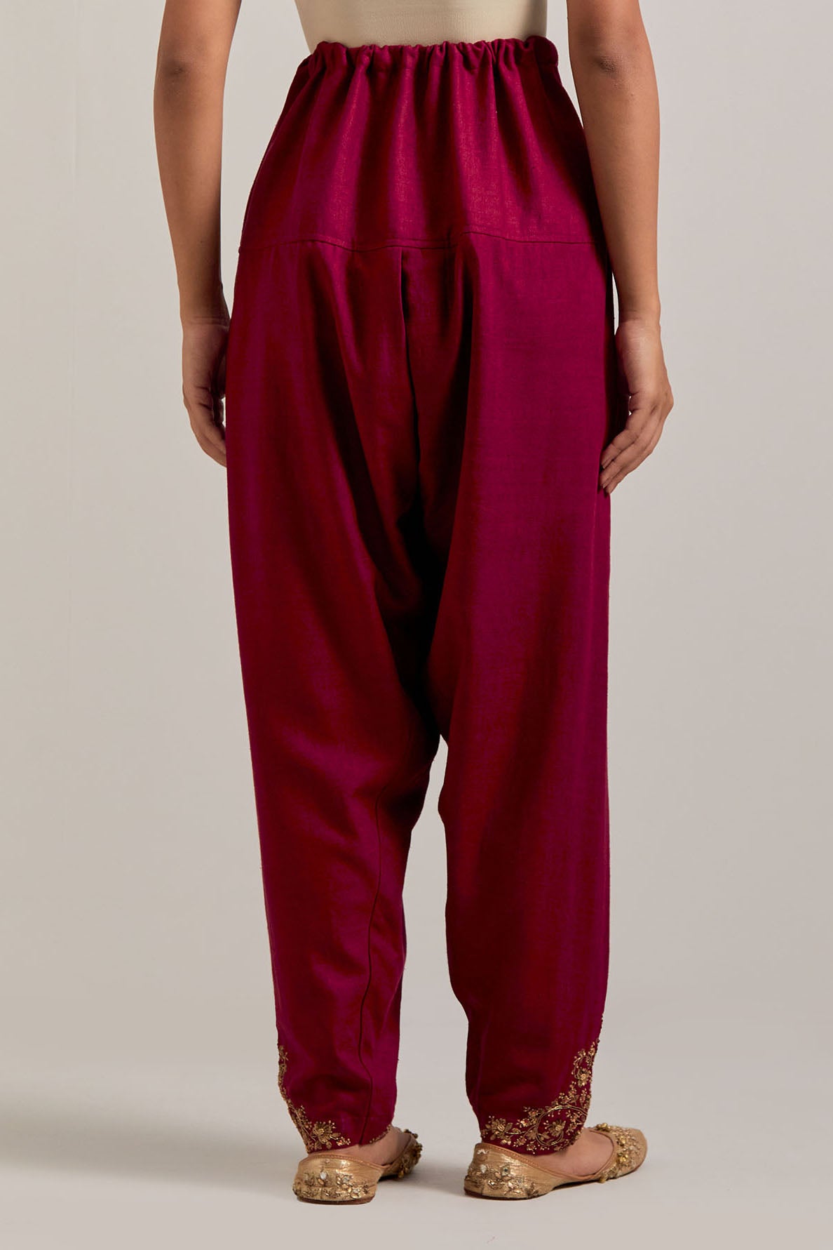 Ruby red Matka silk salwar, highlighted with hand embroidered bead, sequins, zardozi and zari boota at bottom hem.