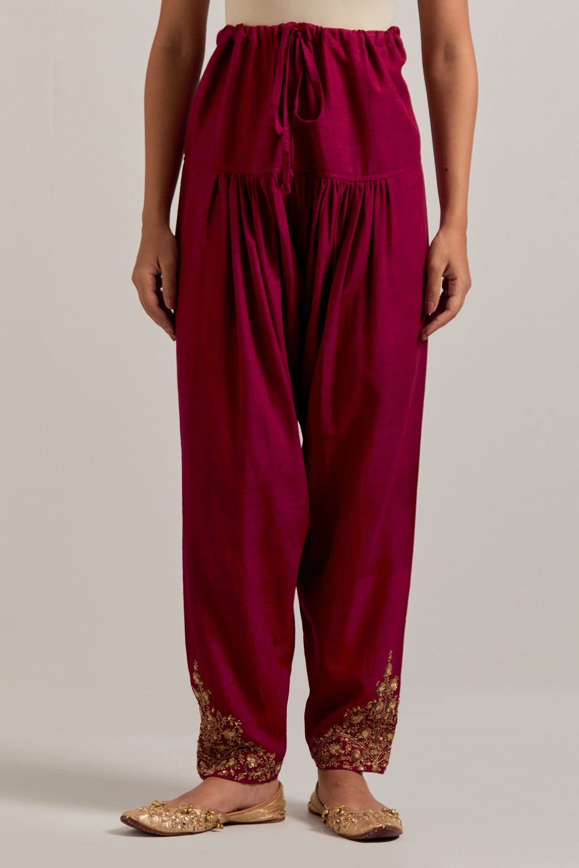 Ruby red Matka silk salwar, highlighted with hand embroidered bead, sequins, zardozi and zari boota at bottom hem.