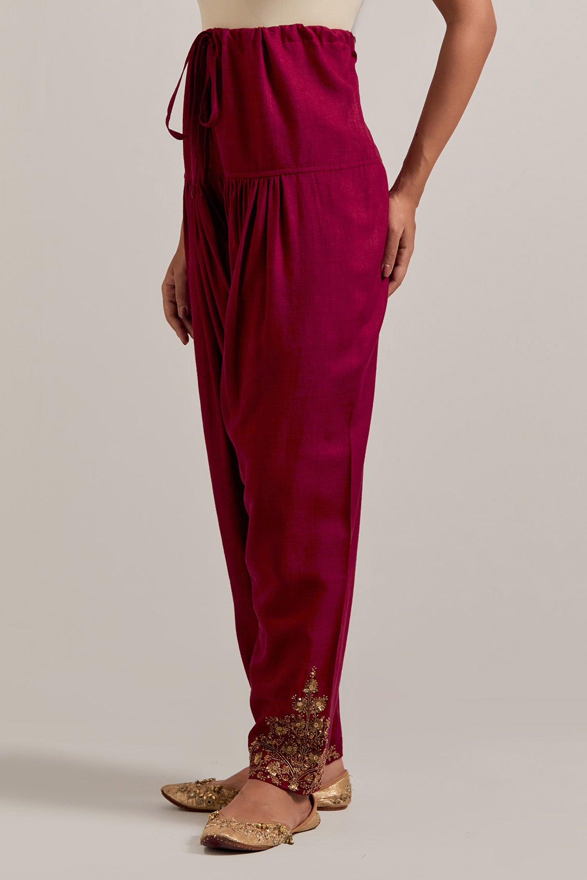 Ruby red Matka silk salwar, highlighted with hand embroidered bead, sequins, zardozi and zari boota at bottom hem.