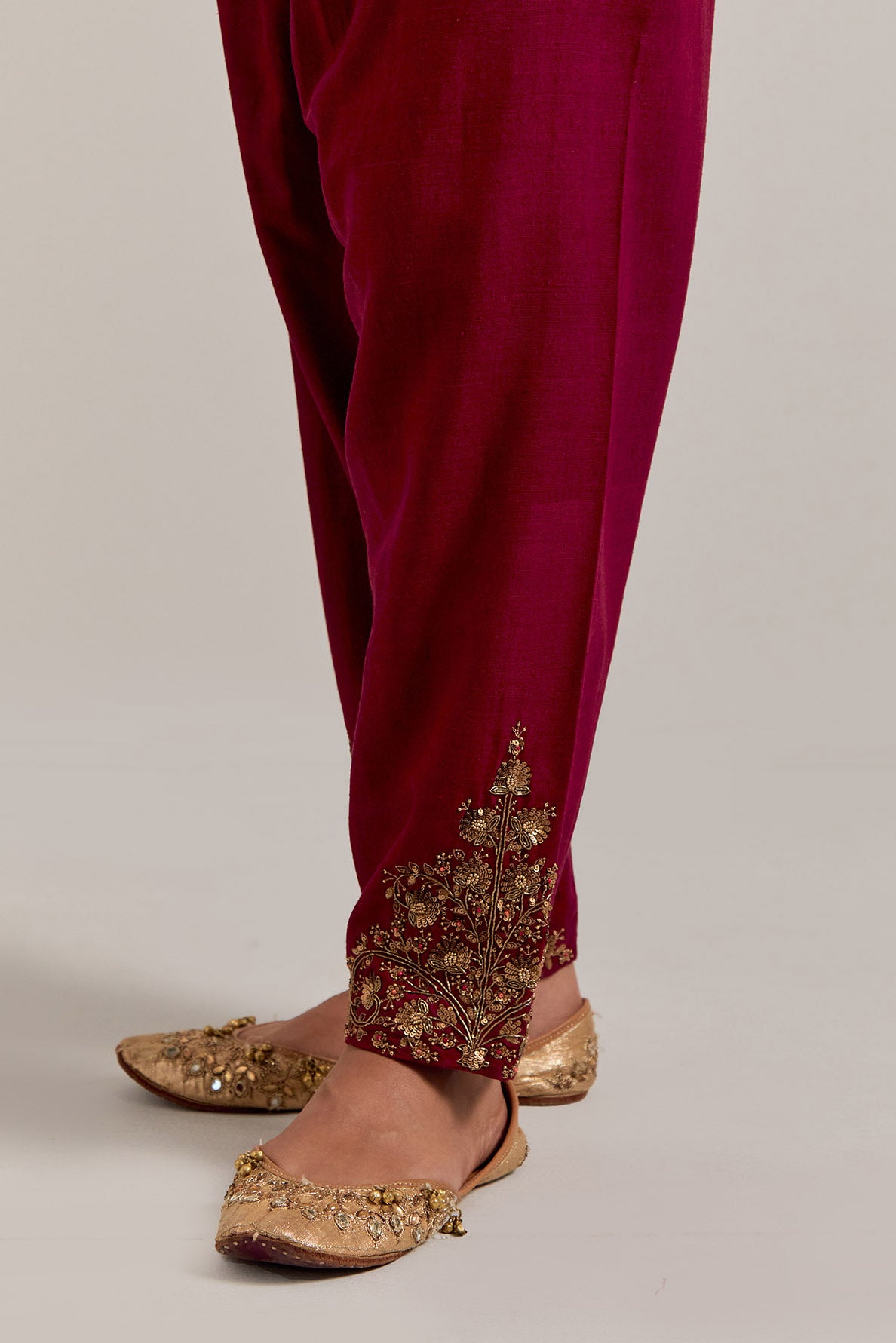 Ruby red Matka silk salwar, highlighted with hand embroidered bead, sequins, zardozi and zari boota at bottom hem.