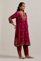 Ruby red easy fit A-line, panelled, short kurta set in Matka silk with all-over hand embroidery at the neck, sleeves and hem.