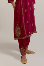 Ruby red easy fit A-line, panelled, short kurta set in Matka silk with all-over hand embroidery at the neck, sleeves and hem.