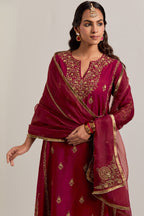 Ruby red easy fit A-line, panelled, short kurta set in Matka silk with all-over hand embroidery at the neck, sleeves and hem.