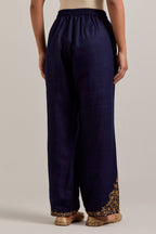Navy blue Matka silk pants, highlighted with hand embroidered bead, sequins, zardozi and zari boota at bottom hem.