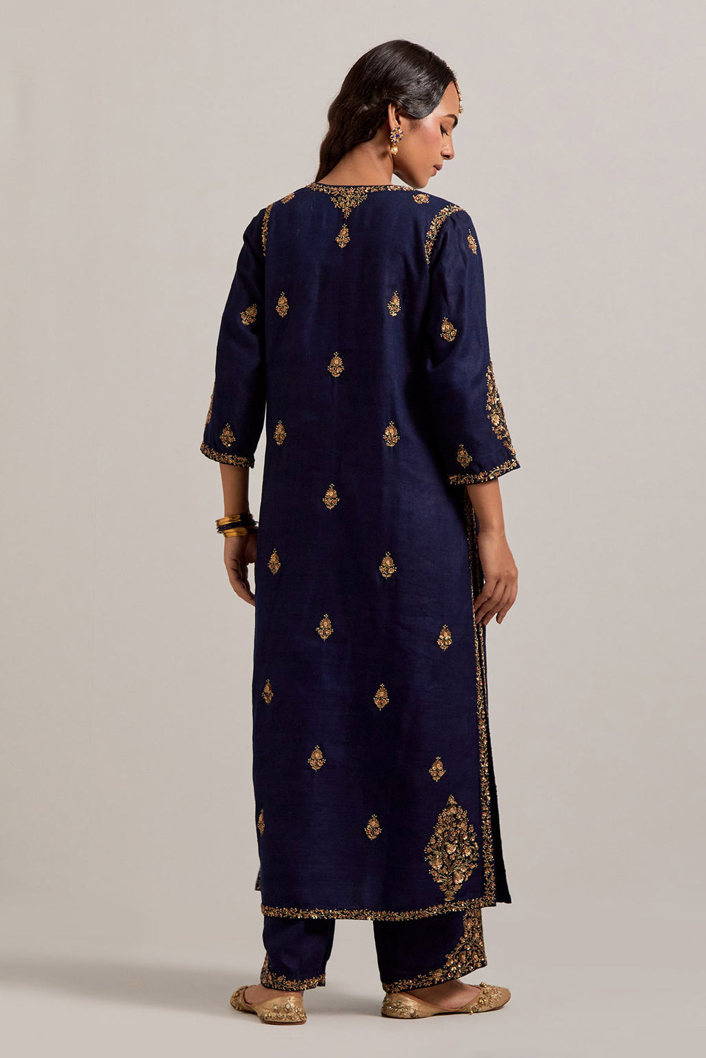Navy blue straight Matka silk kurta set with all-over hand-embroidered small floral booti with sequins, zardozi, bead and zari work.