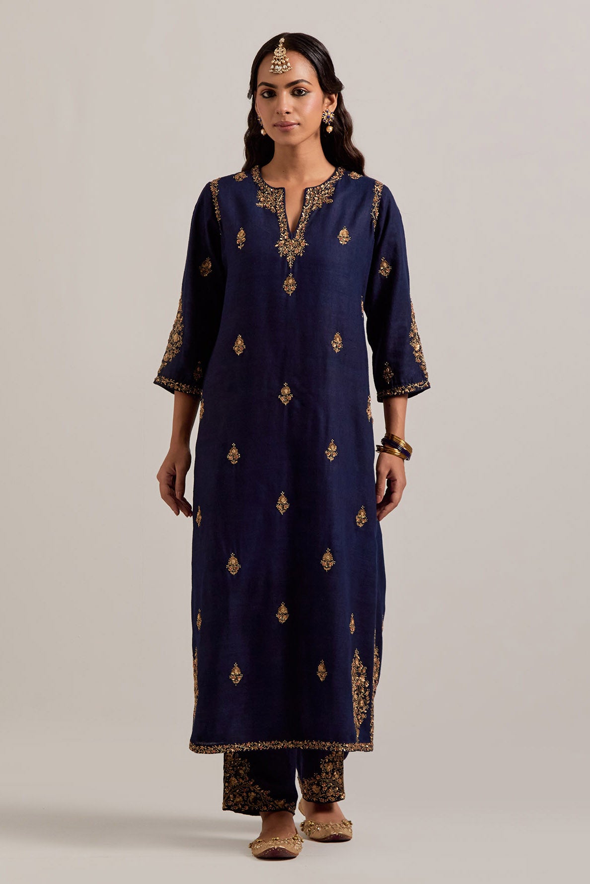 Navy blue straight Matka silk kurta set with all-over hand-embroidered small floral booti with sequins, zardozi, bead and zari work.