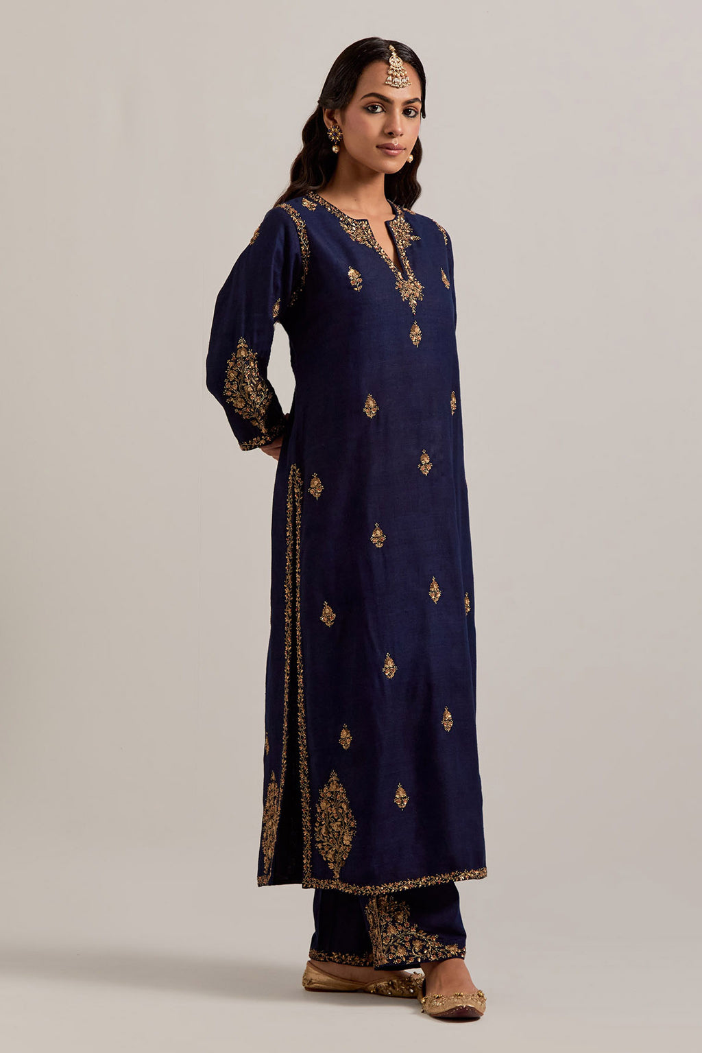 Navy blue straight Matka silk kurta set with all-over hand-embroidered small floral booti with sequins, zardozi, bead and zari work.
