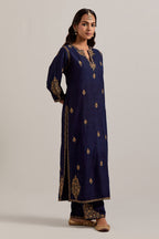 Navy blue straight Matka silk kurta set with all-over hand-embroidered small floral booti with sequins, zardozi, bead and zari work.