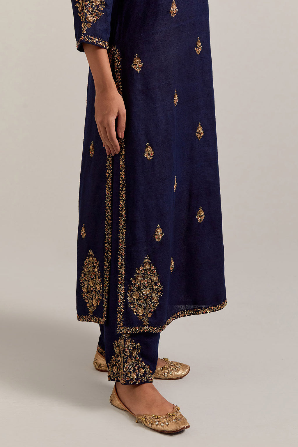 Navy blue straight Matka silk kurta set with all-over hand-embroidered small floral booti with sequins, zardozi, bead and zari work.