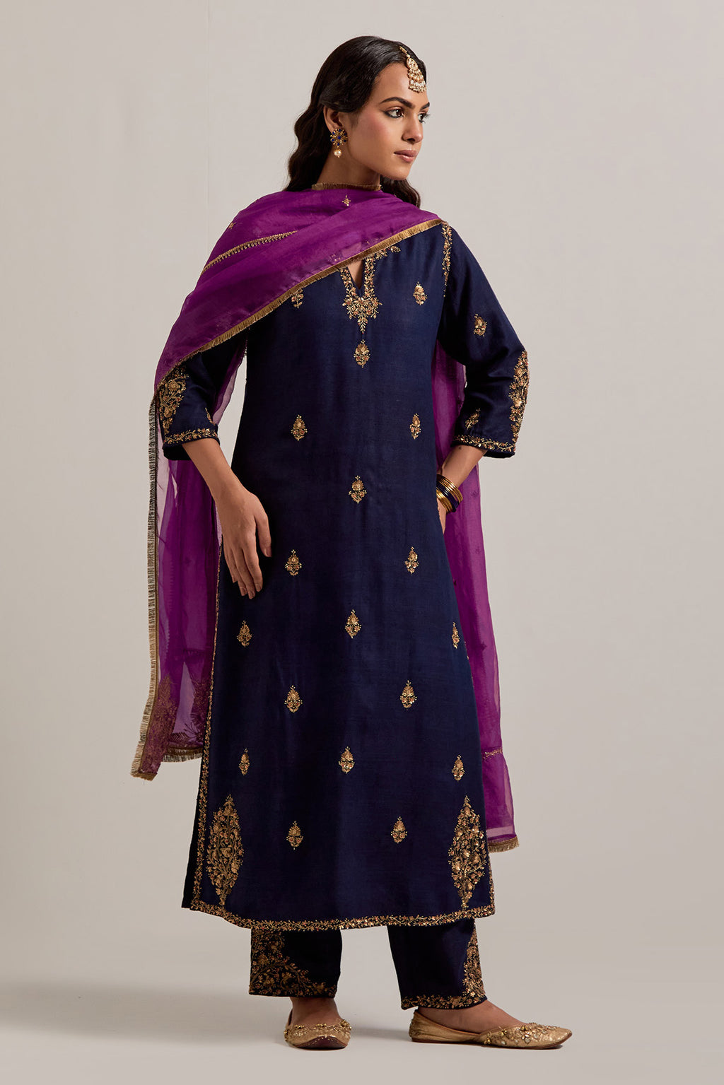 Navy blue straight Matka silk kurta set with all-over hand-embroidered small floral booti with sequins, zardozi, bead and zari work.