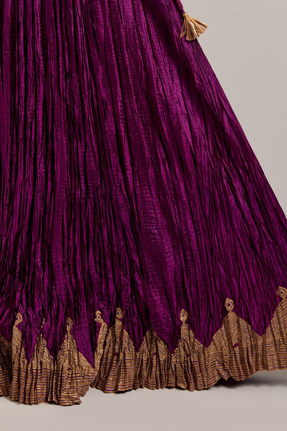 Wine Silk long choli set with all-over sequins, zardozi and zari handwork, highlighted with contrast-colored beads.