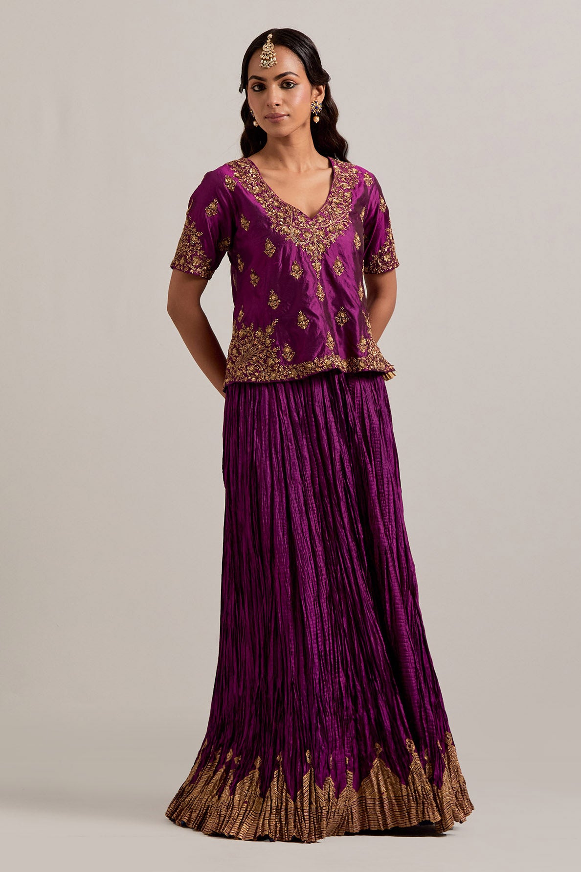 Wine Silk long choli set with all-over sequins, zardozi and zari handwork, highlighted with contrast-colored beads.