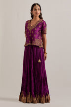 Wine Silk long choli set with all-over sequins, zardozi and zari handwork, highlighted with contrast-colored beads.