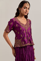 Wine Silk long choli set with all-over sequins, zardozi and zari handwork, highlighted with contrast-colored beads.