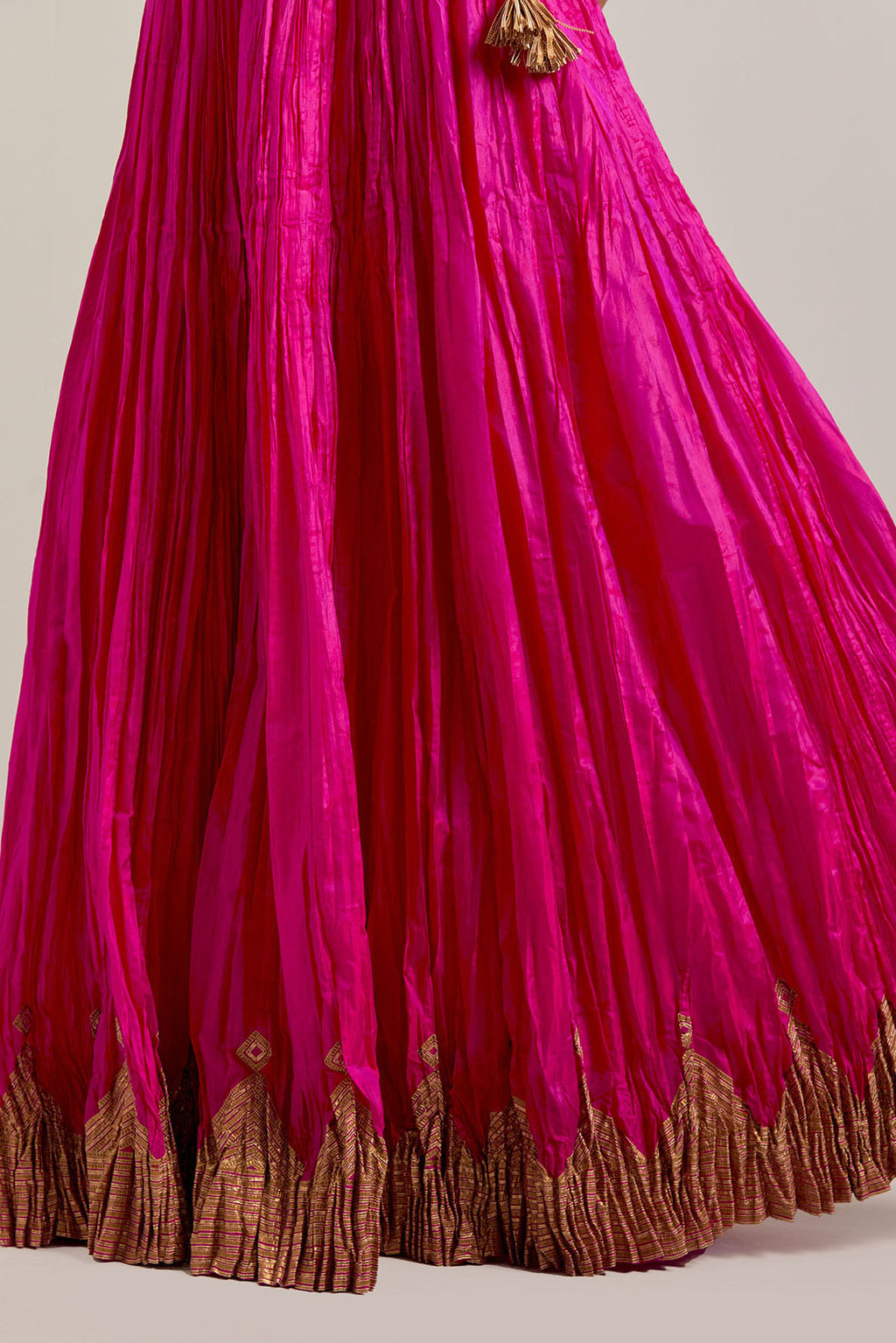 Fuchsia Silk Choli set with all-over sequins, zardozi and zari handwork, highlighted with contrast-colored beads.