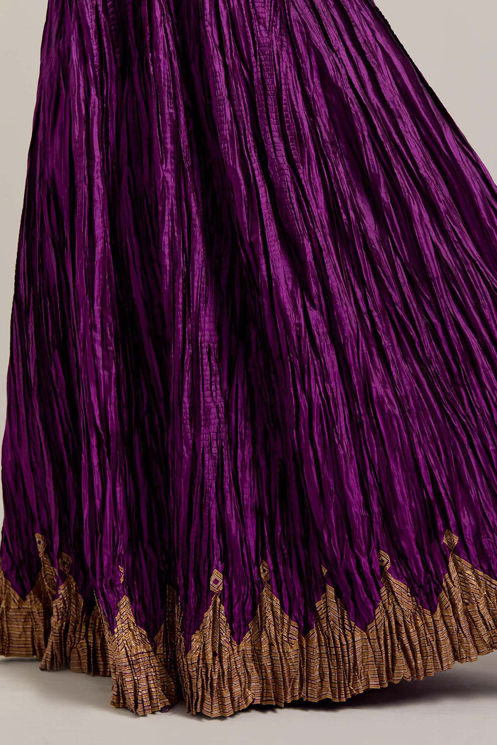 Purple Silk choli set with all-over sequins, zardozi and zari handwork, highlighted with contrast-colored beads.