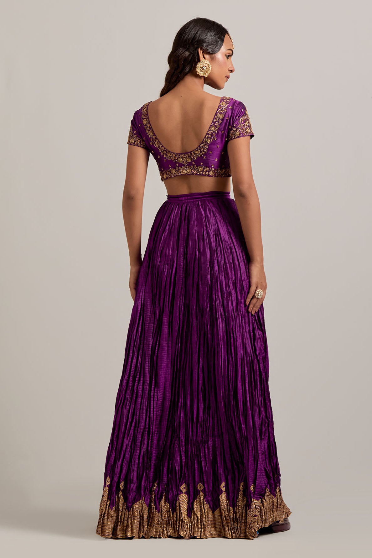 Purple Silk choli set with all-over sequins, zardozi and zari handwork, highlighted with contrast-colored beads.