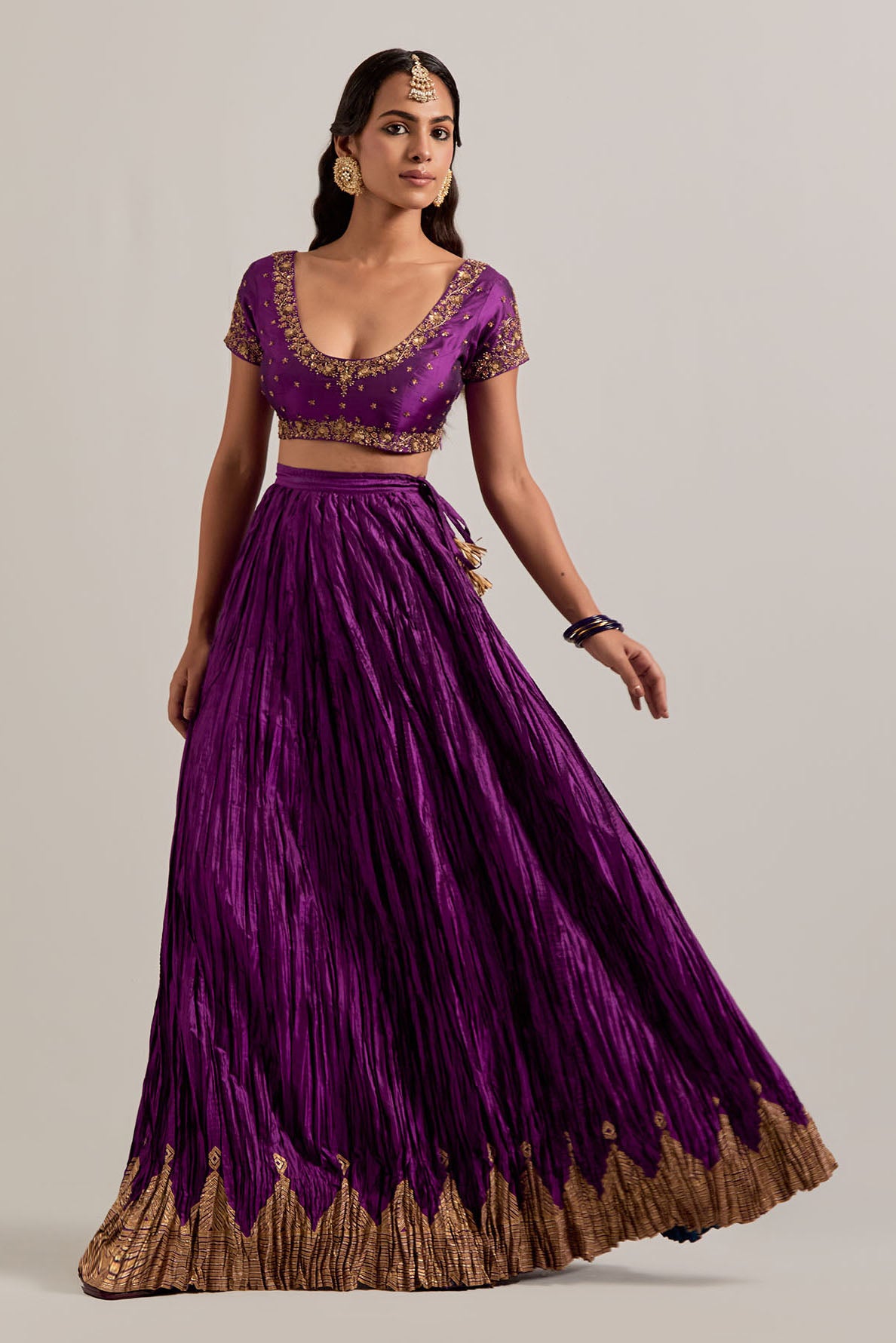 Purple Silk choli set with all-over sequins, zardozi and zari handwork, highlighted with contrast-colored beads.