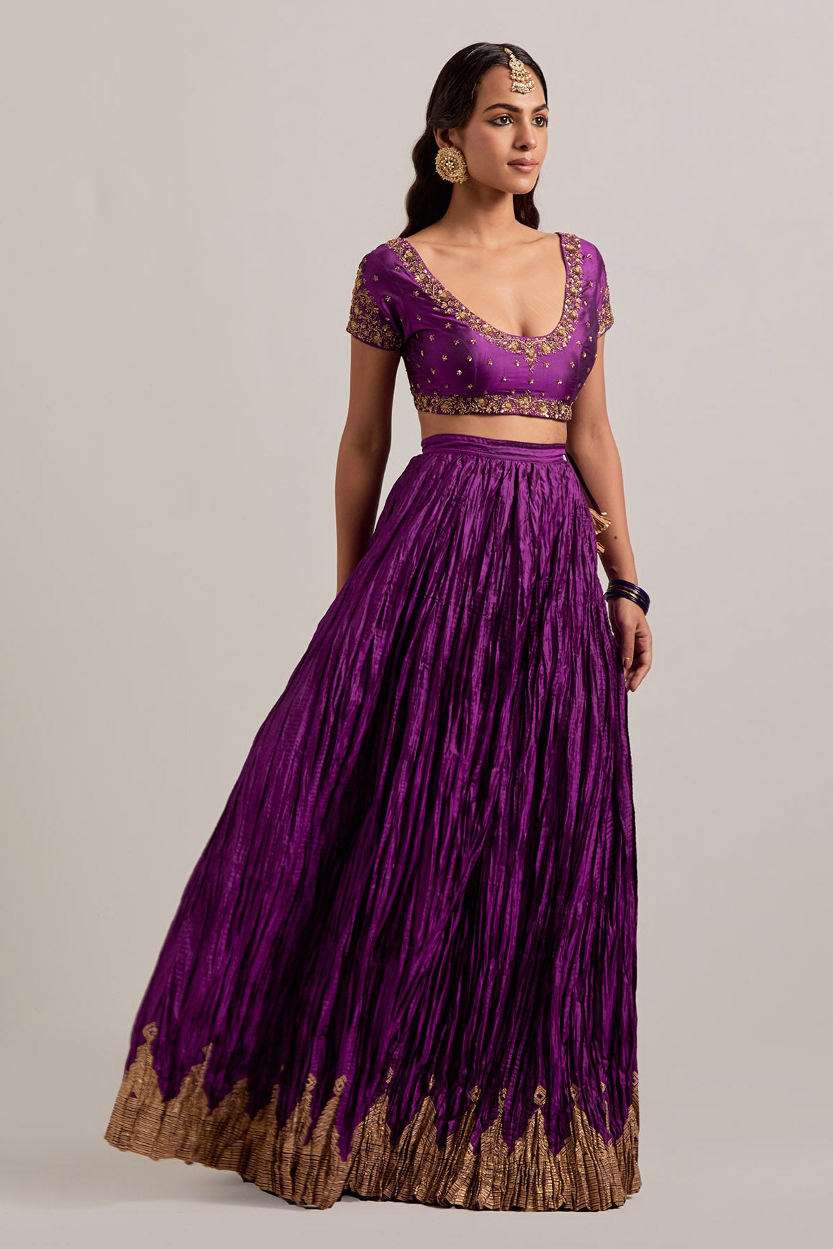 Purple Silk choli set with all-over sequins, zardozi and zari handwork, highlighted with contrast-colored beads.
