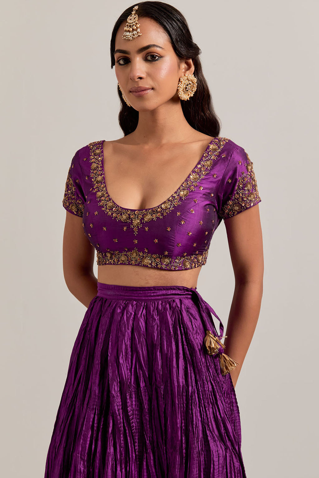 Purple Silk choli set with all-over sequins, zardozi and zari handwork, highlighted with contrast-colored beads.