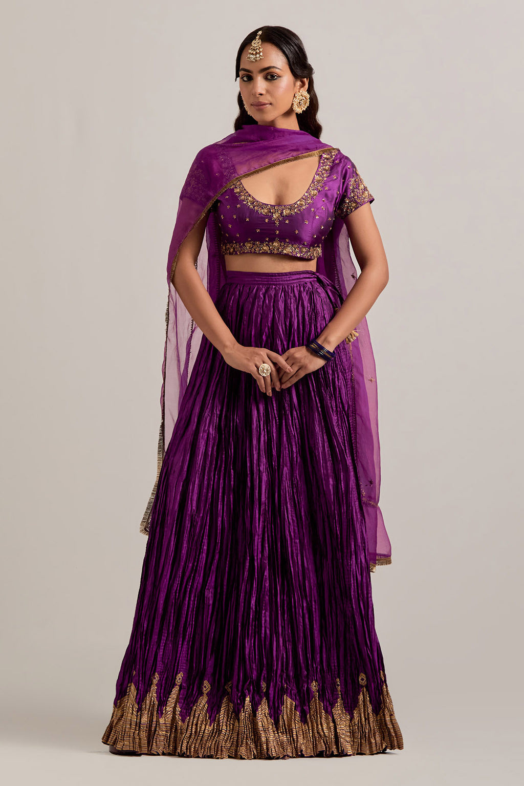 Purple Silk choli set with all-over sequins, zardozi and zari handwork, highlighted with contrast-colored beads.