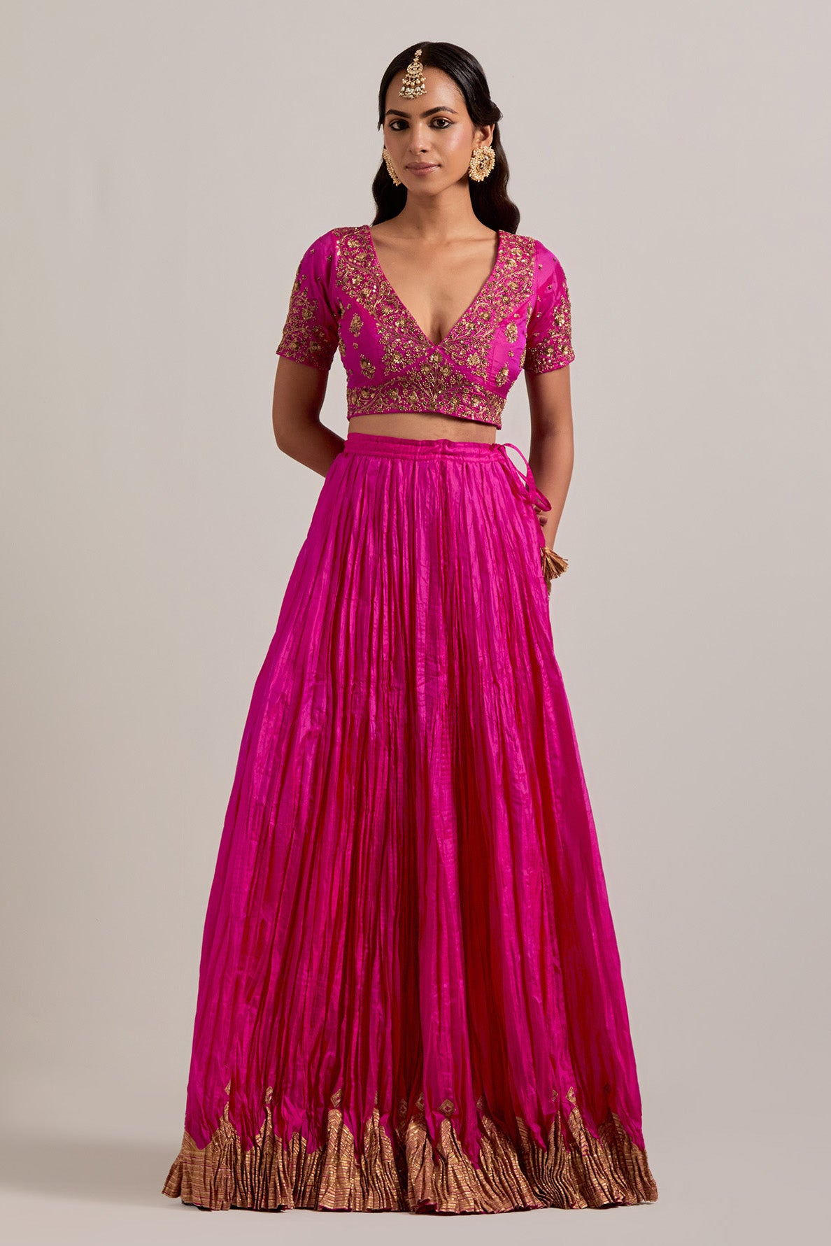 Fuchsia Silk Choli set with all-over sequins, zardozi and zari handwork, highlighted with contrast-colored beads.