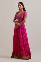 Fuchsia Silk Choli set with all-over sequins, zardozi and zari handwork, highlighted with contrast-colored beads.