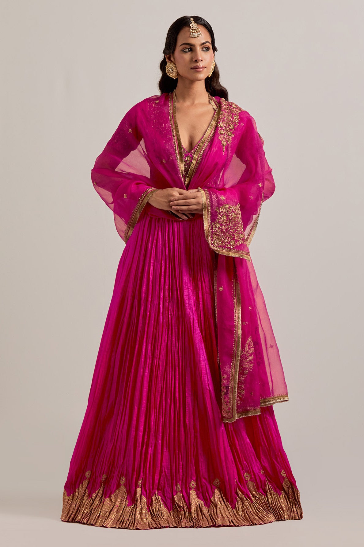 Fuchsia Silk Choli set with all-over sequins, zardozi and zari handwork, highlighted with contrast-colored beads.