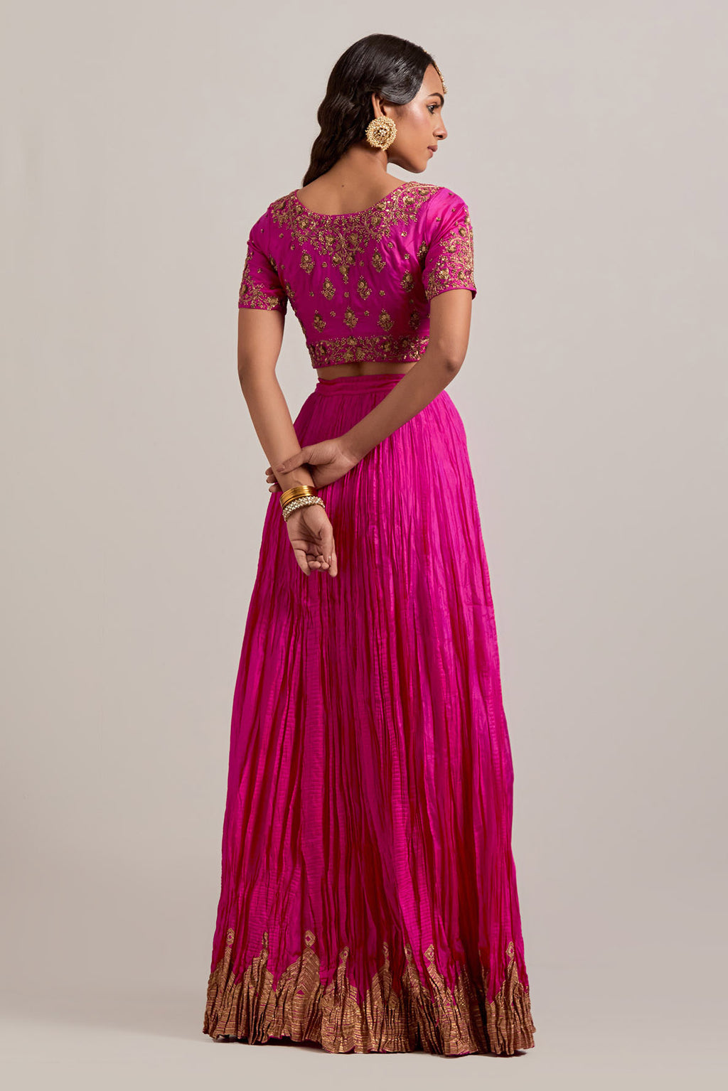 Fuchsia Silk Choli set with all-over sequins, zardozi and zari handwork, highlighted with contrast-colored beads.
