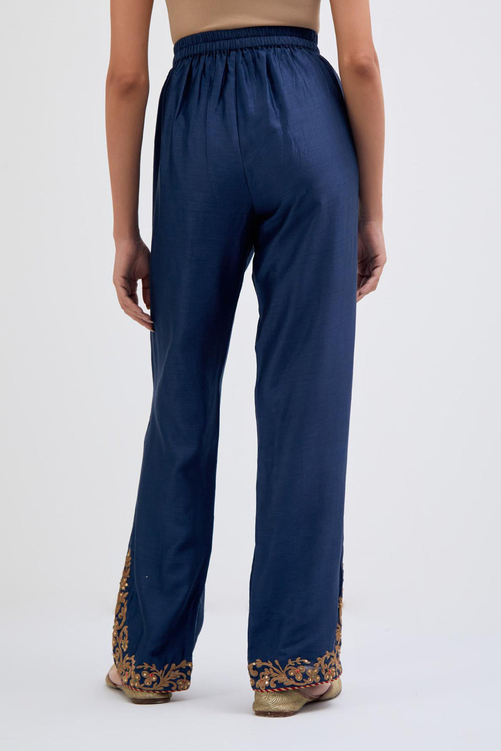 Prussian Blue Silk Chanderi pants with dull gold dori embroidery at hem, highlighted with multi colored beads and gold sequins work.