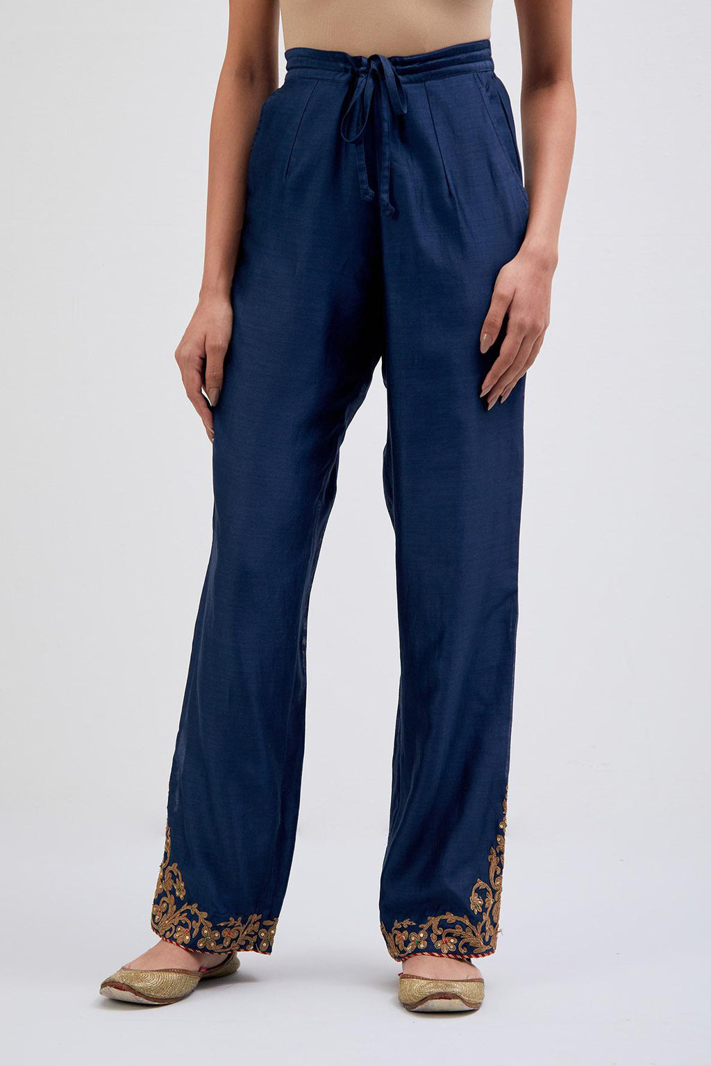 Prussian Blue Silk Chanderi pants with dull gold dori embroidery at hem, highlighted with multi colored beads and gold sequins work.