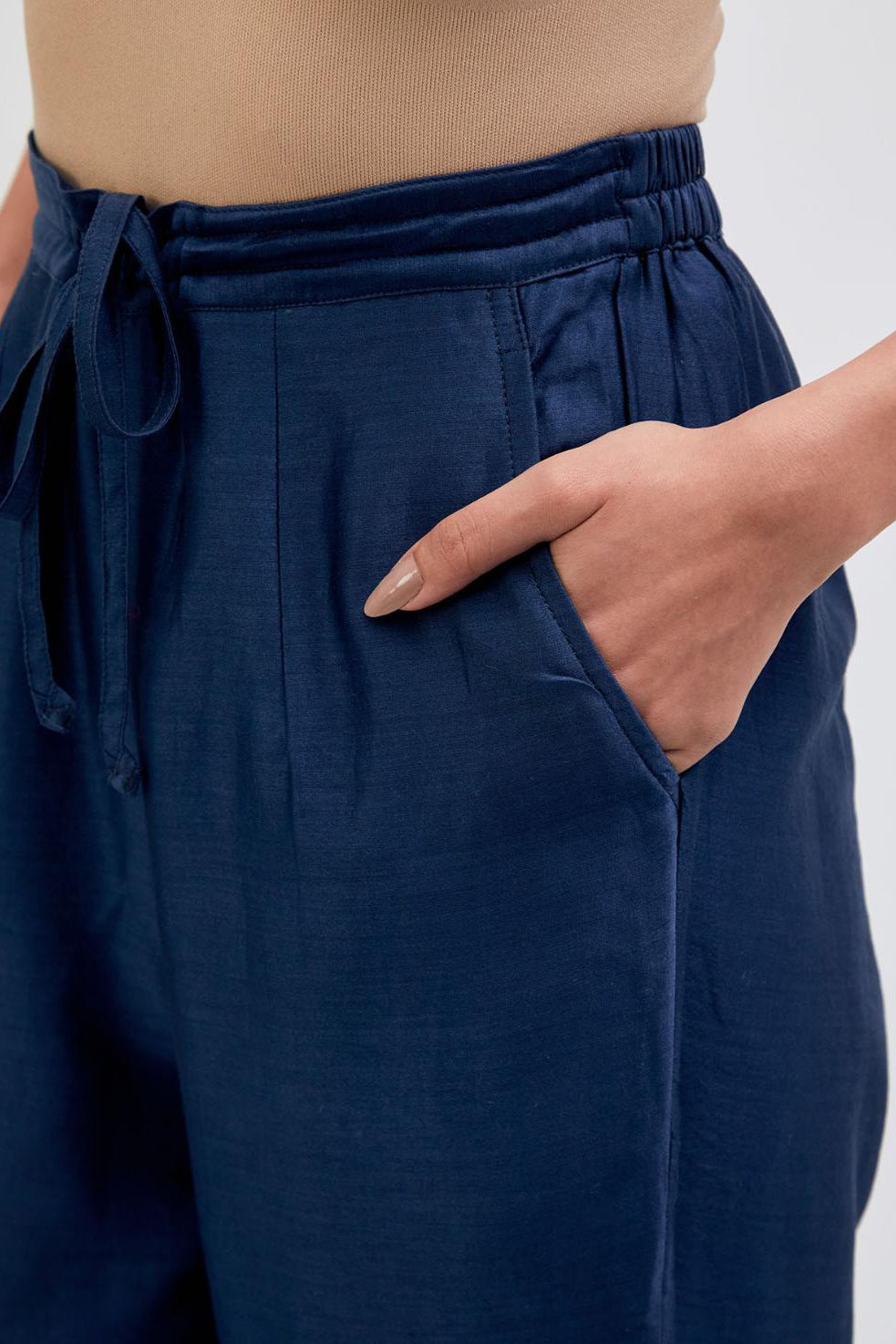 Prussian Blue Silk Chanderi pants with dull gold dori embroidery at hem, highlighted with multi colored beads and gold sequins work.